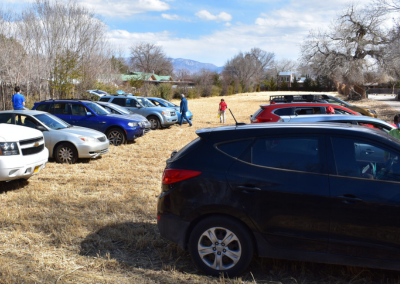 Another view of the cars on the field.