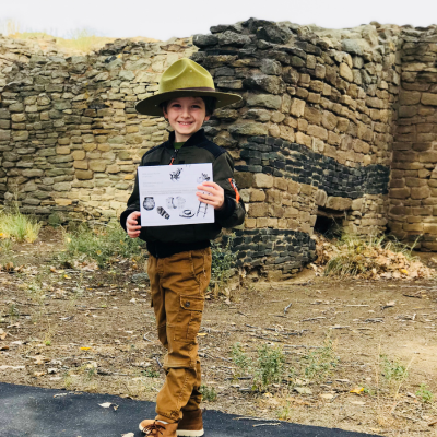 Evan's first Junior Ranger badge at Aztec Ruins National Monument
